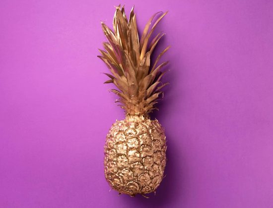 creative-layout-gold-pineapple-on-violet-backgroun-NJ6LXD5-scaled-1.jpg